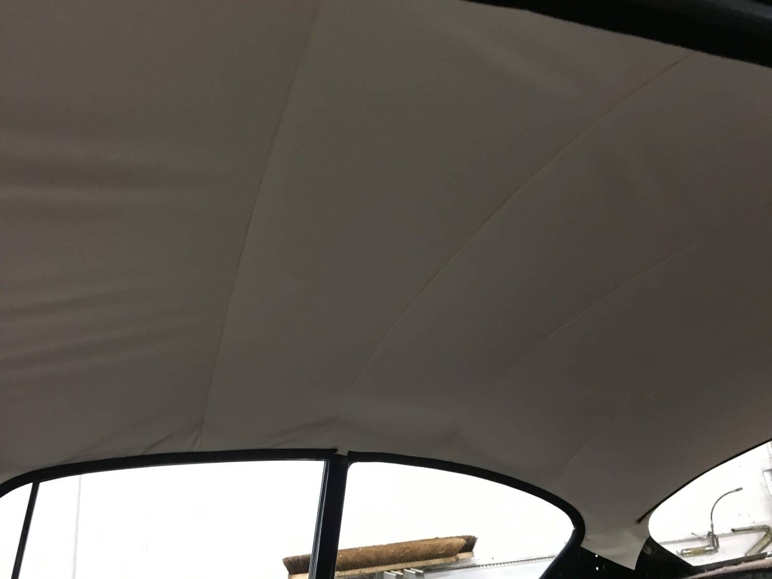 Fitting up the new ceiling cloth Bridge Classic Cars